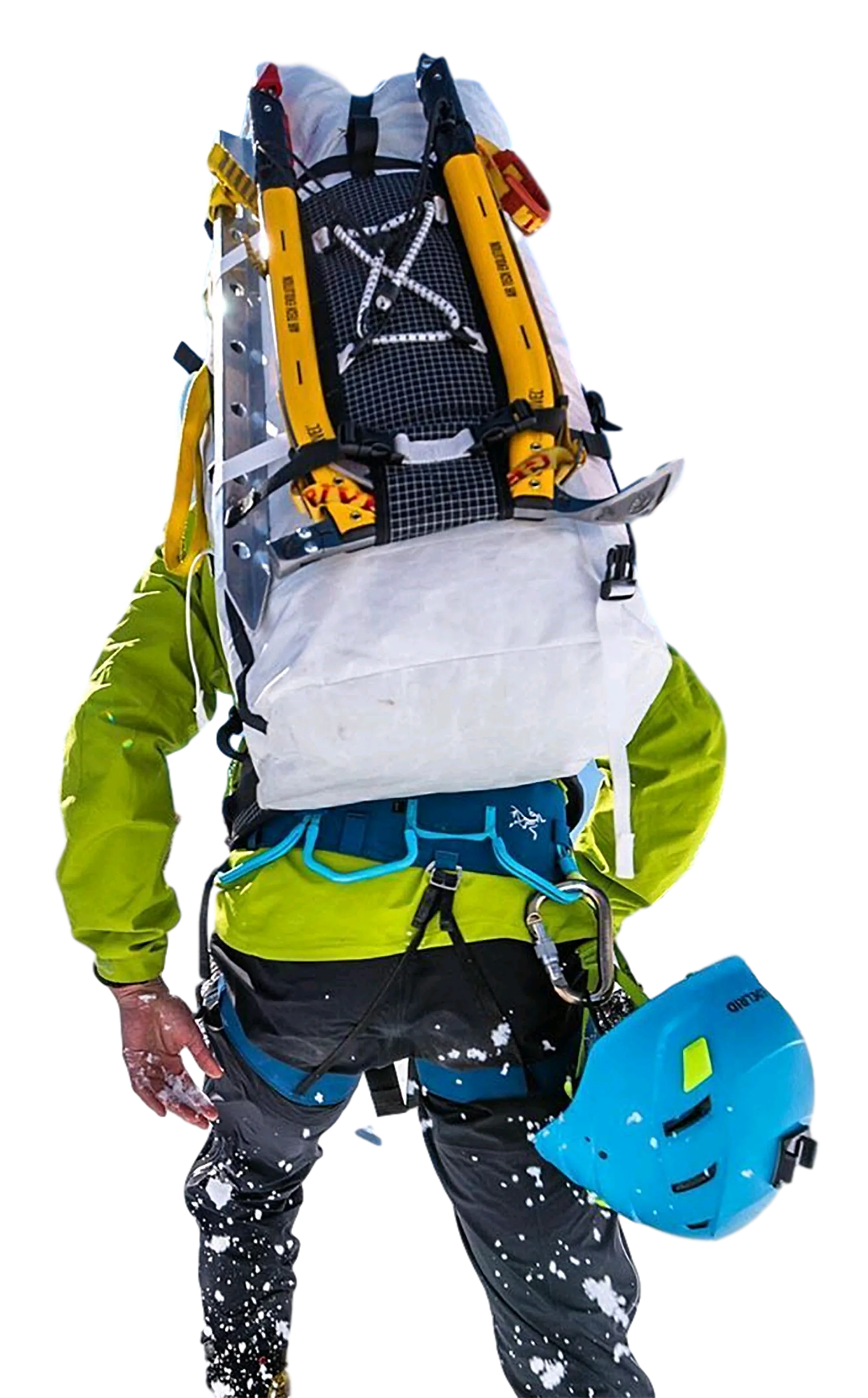 mountaineer with ice axes on backpack